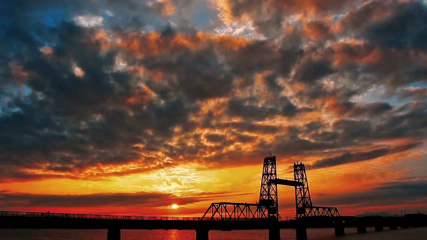 Bridge Silhouette Against Dramatic Sunset Sky