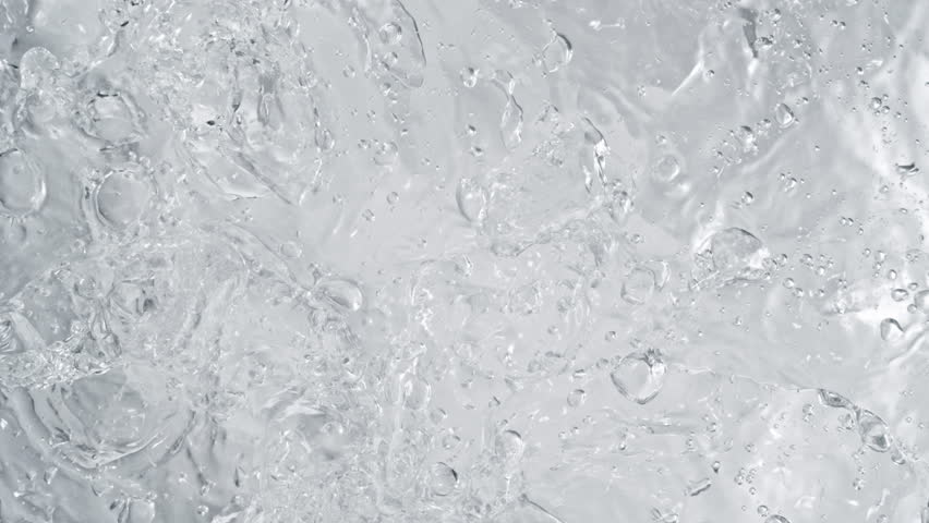 Super Slow Motion Shot of Pure Water Followed by Camera Splashing into Surface at 1000fps.