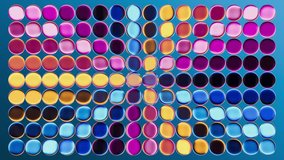 Abstract simple neon background, looping 3d animation. Animated grid of multicolor round glass bubbles, radiating with energetic gradient spectrum in a seamless loop. Multicolored mosaic - Powered by Shutterstock - Get 15% off with code: PIKWIZARD15