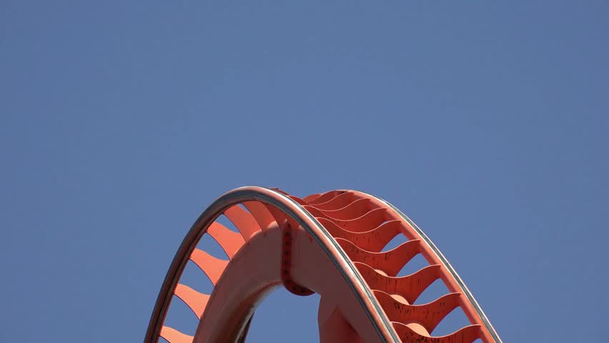 A thrilling roller coaster speeding through loops and sharp turns, showcasing excitement, adrenaline, and amusement park vibes.