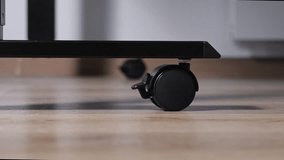 Sturdy black caster wheel provides reliable mobility and stationary stability for office chairs or modern furniture, enhancing functionality in various interior spaces - Powered by Shutterstock - Get 15% off with code: PIKWIZARD15
