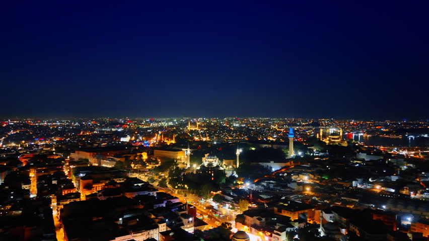 Vast luminous cityscape of a beautiful modern Istanbul, Turkey. Breath-taking scenery of the capital at night. Aerial view.