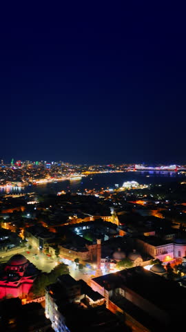 Gorgeous Istanbul, Turkey with multiple lights. Drone footage over the stunning capital at night. Vertical video.