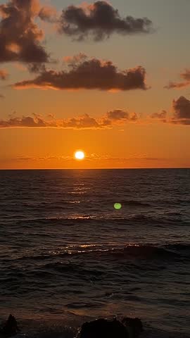 Sunset Over the Ocean on a Calm Evening at the Beach in a Coastal Location