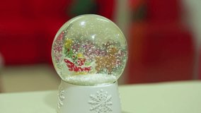 This festive video features a cheerful snowman adorned with colorful Christmas lights in a serene winter landscape. Softly falling snow creates a magical atmosphere, enhancing the cozy and joyful ambi - Powered by Shutterstock - Get 15% off with code: PIKWIZARD15