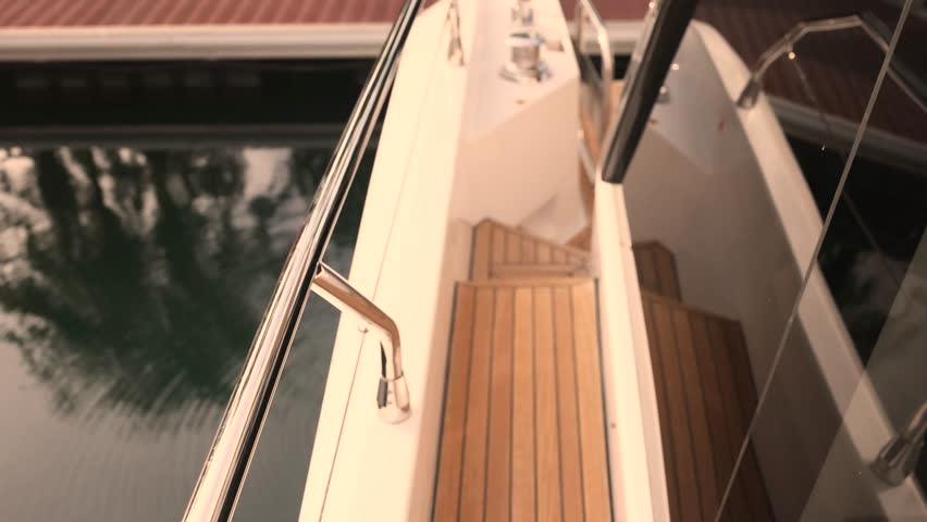 Walking along luxurious yacht exterior and interior with natural wood details