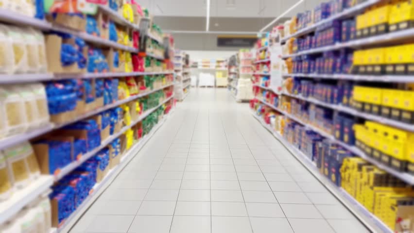 choosing a dairy products at supermarket.various goods on the supermarket shelves