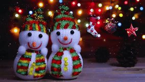 This charming holiday video showcases cheerful Christmas snowmen set in a peaceful winter landscape, surrounded by soft falling snow and warm seasonal décor. The snowmen, adorned with festive scarves, - Powered by Shutterstock - Get 15% off with code: PIKWIZARD15