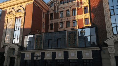 Drone Ascending Past Detailed Architectural Reliefs