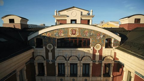 Drone Descending Backward across Ornate Building