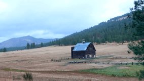 Abandoned barn on rolling hills during sunset in Washington state. - Powered by Shutterstock - Get 15% off with code: PIKWIZARD15
