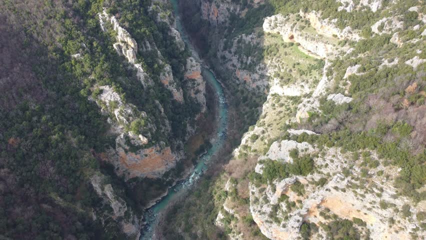 Aerial 4K drone footage of Vikos Gorge in Zagori, Epirus, Greece, showing a deep canyon, steep cliffs, and stunning natural scenery. Ideal for travel, nature, and documentary projects.