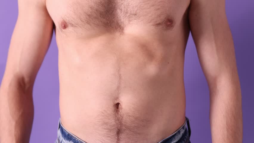 Man with healthy stomach on violet background, closeup