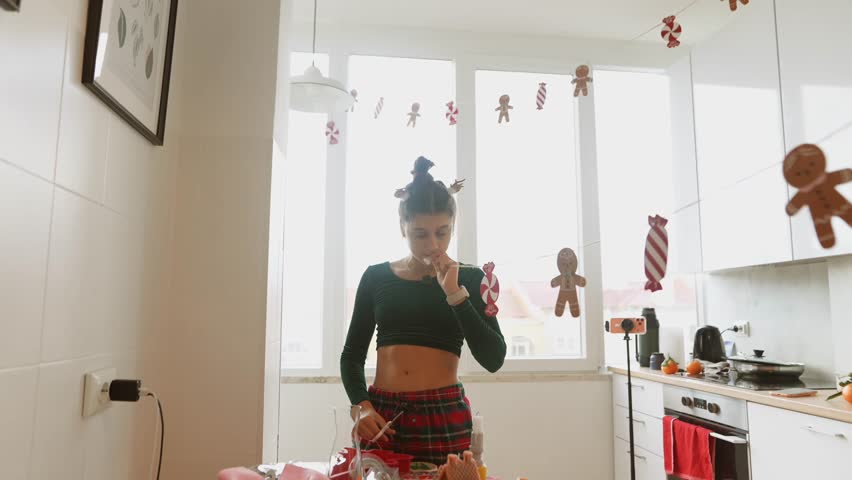 young white woman pastry stylist tasting holiday treats