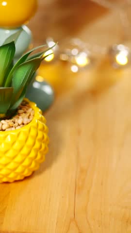 Bright yellow pineapple planter adds charm to home decor