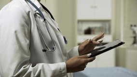Closeup of a female doctor reviewing an X-ray on a tablet PC, highlighting digital healthcare, medical diagnostics, and modern technology in a clinical setting. - Powered by Shutterstock - Get 15% off with code: PIKWIZARD15
