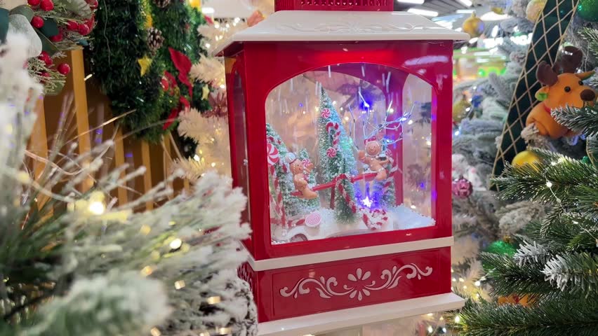 snow lantern decorated with gingerbread men, candy canes, and Christmas trees creates a cute festive winter scene filled with holiday charm