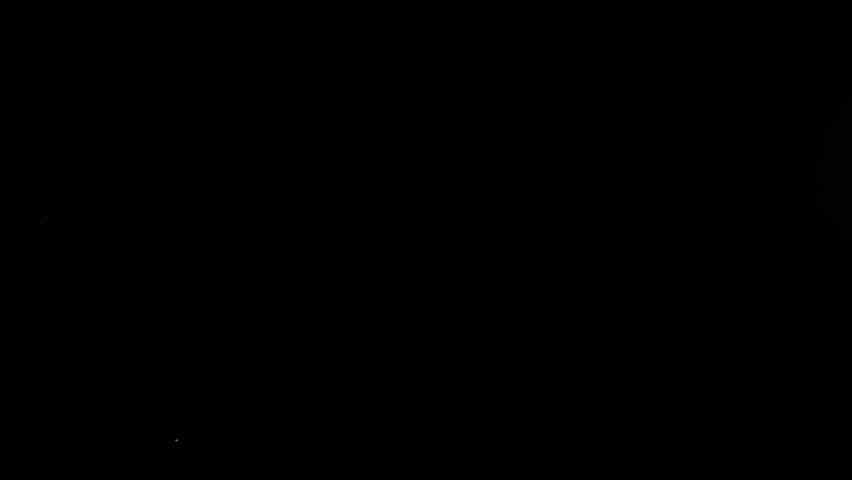 Super Slow Motion Shot of Real Side-Flying Glass Shards Isolated on Black at 1000 fps.