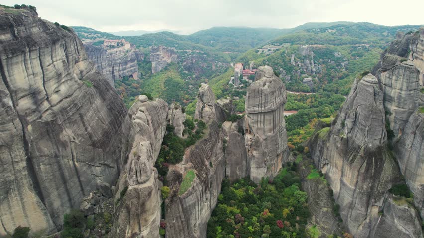 Drone View of Meteora Rock Formations, Greece. Majestic Meteora Mountains 4K Ultra HD Aerial Landscape Footage.