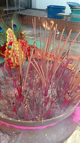 Burning Incense Sticks at Shrine