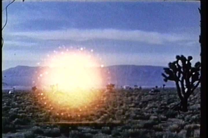 1950s - A model village is blown away by a nuclear bomb blast in the Nevada desert.