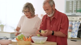 Mature couple working together in home kitchen, carefully peeling fresh apples while sharing joyful moment of meal preparation and healthy eating - Powered by Shutterstock - Get 15% off with code: PIKWIZARD15