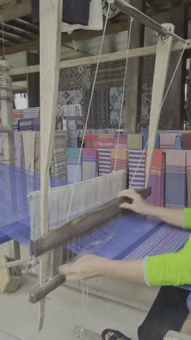 Scenic Landscape of a Karst Mountain Reflected in a Lake with Water Lilies and Tourists Boating, Ninh Binh, Vietnam