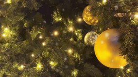 Christmas Footage With Golden Christmas Baubles Hanging On Festive Tree With Lights And Falling Snow. Perfect For New Year Mood, Holiday Visuals, Seasonal Greeting Videos, Winter Celebration Content - Powered by Shutterstock - Get 15% off with code: PIKWIZARD15
