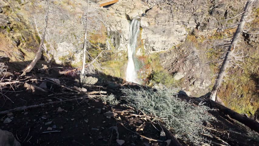 This scenic view captures Mill Creek Falls, the tallest waterfall in the park, cascading 75 feet down a narrow chute, visible from the end of a moderately strenuous trail