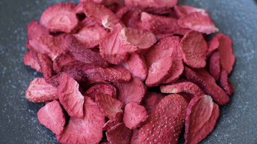 Dried sublimated slices of strawberry as an ingredient for sweet desserts. Dried strawberry as a food background for your design