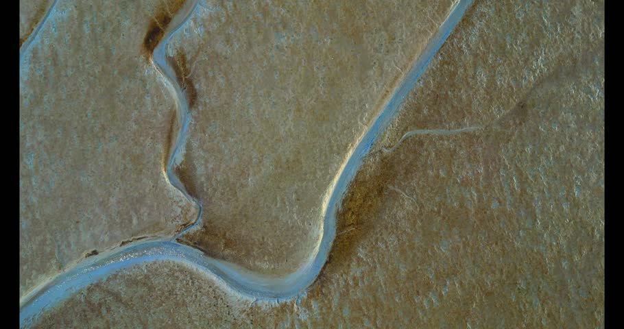 Aerial view of the tidal mudflats and channels of the Eemsdelta, Groningen, The Netherlands