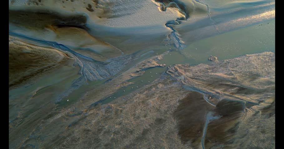 Aerial view of the tidal mudflats and channels of the Eemsdelta, Groningen, The Netherlands
