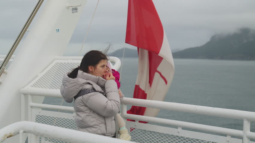 Mother and daughter enjoying ferry ride together