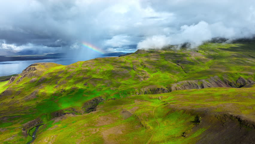 Clouds Above Green Hills, Mountain Range in Iceland Aerial View