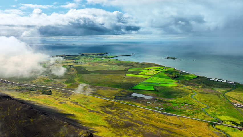 Clouds Above Green Hills, Mountain Range in Iceland Aerial View