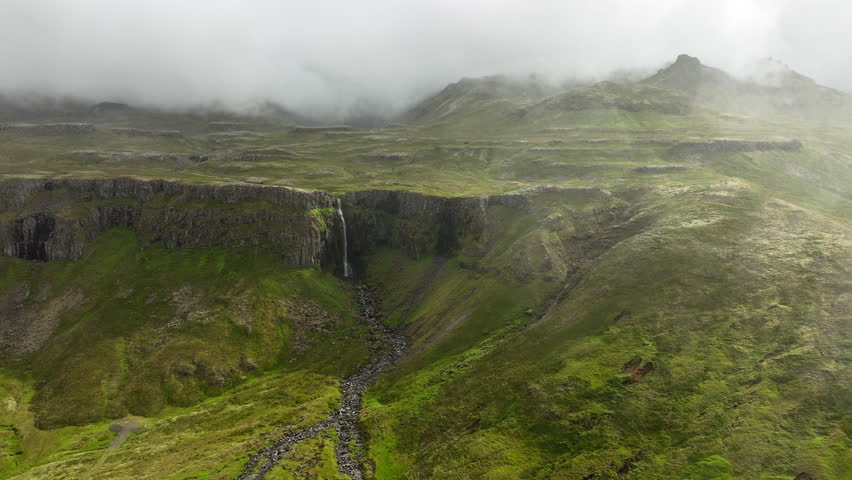Clouds Above Green Hills, Mountain Range in Iceland Aerial View