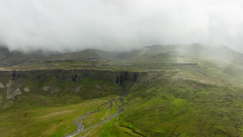 Clouds Above Green Hills, Mountain Range in Iceland Aerial View