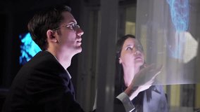 Business Team working in office, analyzing reports and entering data. Team members collaborating on artificial intelligence project talk about enterprise AI, deep learning, big data, neural networks. - Powered by Shutterstock - Get 15% off with code: PIKWIZARD15