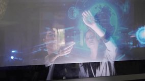 Two people are discussing cybersecurity in an office. They interact with a digital screen showing data and security graphics. The focus is on collaboration and technology use. - Powered by Shutterstock - Get 15% off with code: PIKWIZARD15