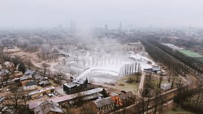 Urban park in Latvia blanketed with fog and fake snow on cold February day - Powered by Shutterstock - Get 15% off with code: PIKWIZARD15