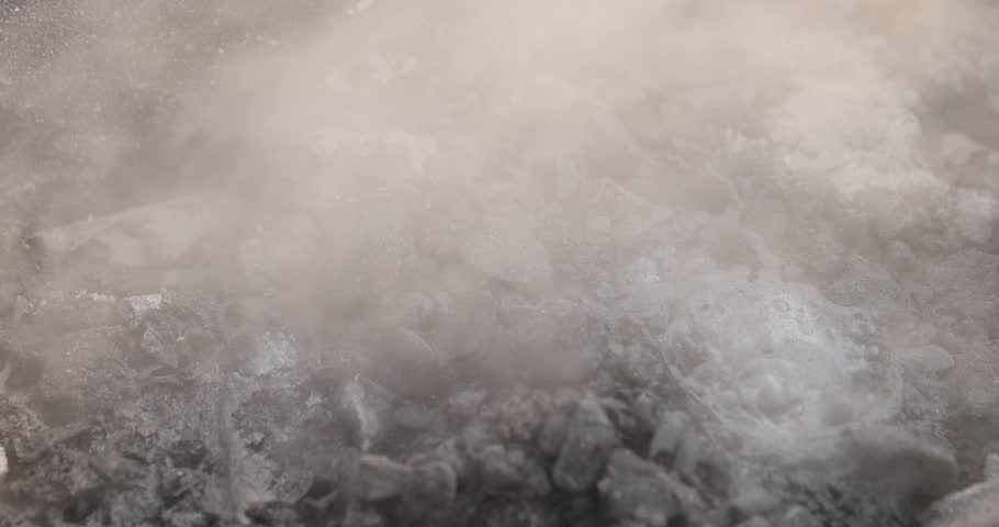 burnt coals from logs with a lot of dust and fumes, dust and burnt coals after cooking in the grill