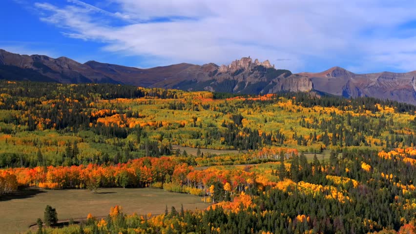 Crested Butte Ohio Kebler Pass Colorado aerial drone The Castle Mountain Mill rock Castle Gunnison National Forest morning autumn fall Aspen tree colors blue sky cloud farmland circle right upwards
