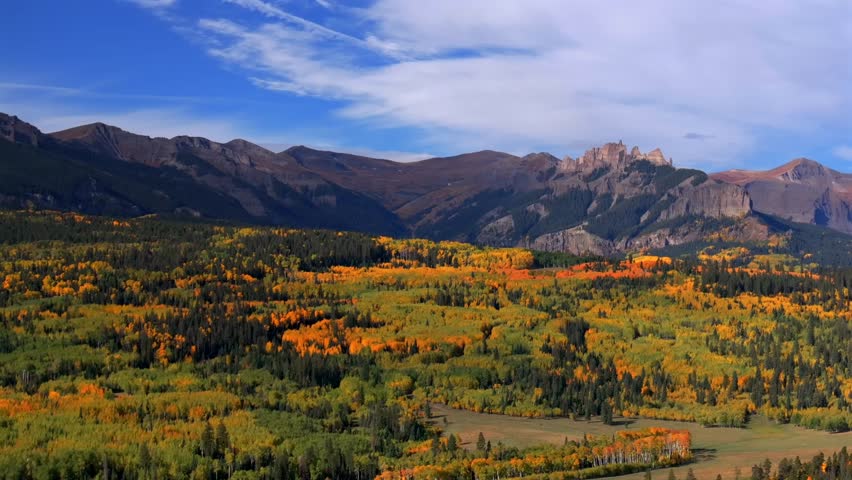 Crested Butte Ohio Kebler Pass Colorado aerial drone The Castle Mountain Mill rock Castle Gunnison National Forest morning autumn fall Aspen tree colors blue sky cloud farmland parallax upwards