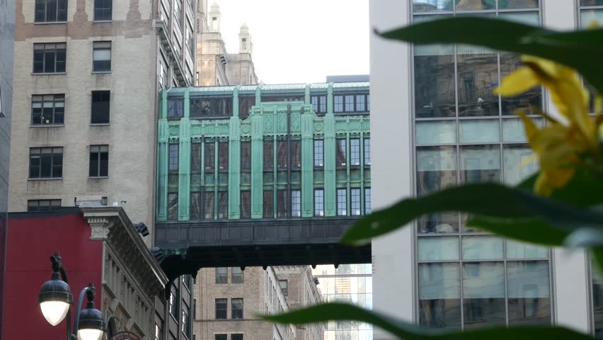 New York City Gimbels bridge, Manhattan Midtown, United States of America. Skybridge on Broadway, Herald Square, USA. Gimbels traverse on 6 avenue. Historic elevated walkway 1925, copper green patina.