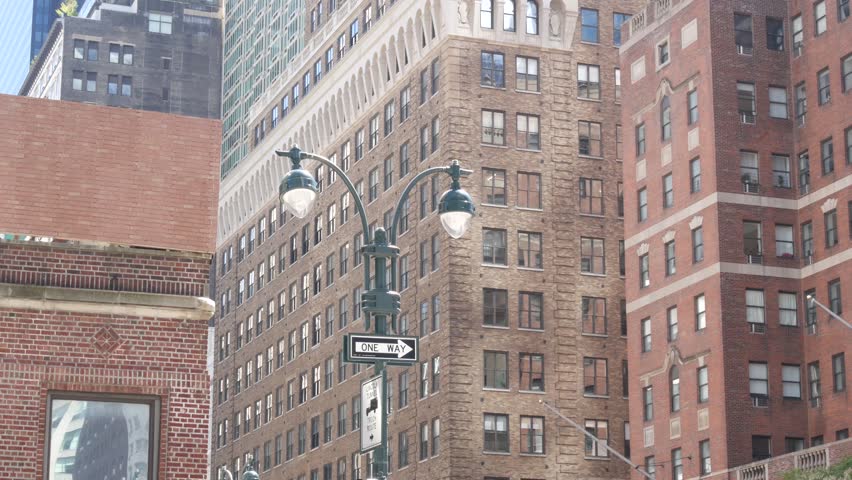 New York City Midtown urban buildings architecture, Manhattan 34 street, 9th ninth avenue, United States of America. Red brick towers near Penn Station, USA. Typical old house in NYC. Hells Kitchen.