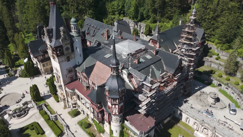 Aerial view of the palace’s rooflines and spires, showcasing the neo-renaissance design and historic charm.