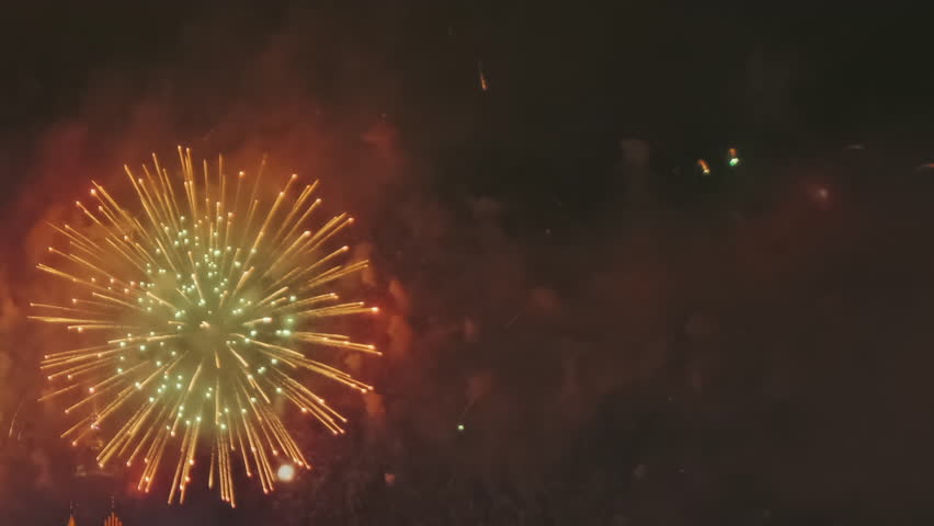 Bright fireworks exploding in night sky. Festive celebration light show. Holiday event display