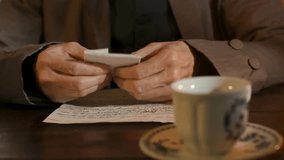 Close-up of an 18th-century man opening a wax-sealed letter and reading, capturing historic correspondence, vintage lifestyle, and period detail. - Powered by Shutterstock - Get 15% off with code: PIKWIZARD15