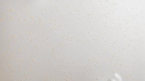 Transparent cosmetic gel smear with particles closeup, Exfoliating Scrub Fluid, Skincare peeling swatch smudge. Beauty Cleansing Liquid. Organic viscous Cosmetics Product texture with beads, face or b - Powered by Shutterstock - Get 15% off with code: PIKWIZARD15