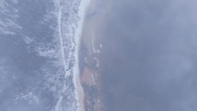 Overhead view of Latvia’s Vidzeme shore with icy forest, sea mist, snowy beach - Powered by Shutterstock - Get 15% off with code: PIKWIZARD15